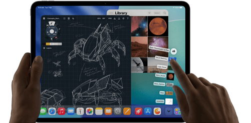 iPad Pro, space black colour, left hand holding device, right hand pointing gesturing to manipulate multiple open app windows, a drawing app with sketches of mechanical designs, photos library of planets and space images, downloads folder files fanned out